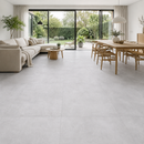 Vloertegel betonlook Concrete Grey 100 x 100 cm - woonkamer met zithoek en eettafel op betonlook vloer in grijs